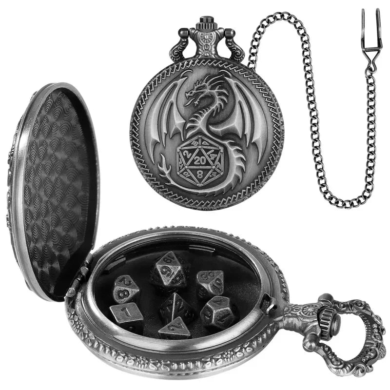 A silver-toned pocket watch styled as a dragon pendant, shown both closed and open. The open watch reveals a black interior with several polyhedral gaming dice inside.
