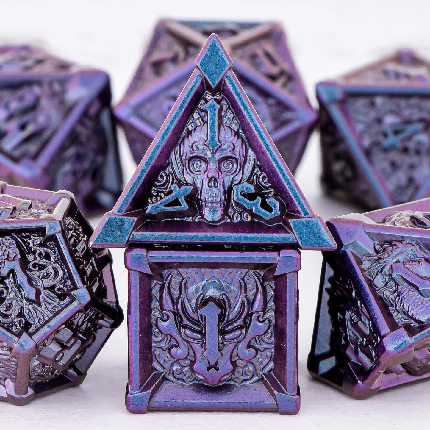 Purple and blue polyhedral dice set on a white background