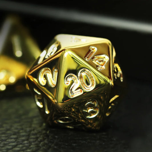 Gold polyhedral dice with '20' on a dark surface