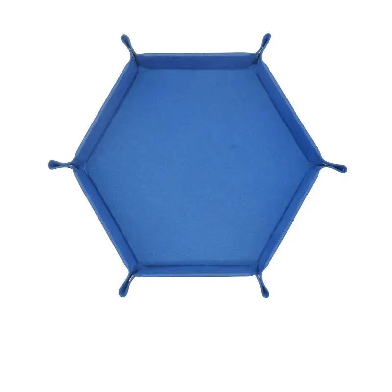 Hexagonal blue velvet dice plate on a white background