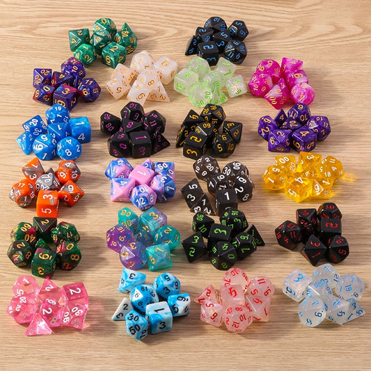 Assorted colorful polyhedral dice set on a wooden surface