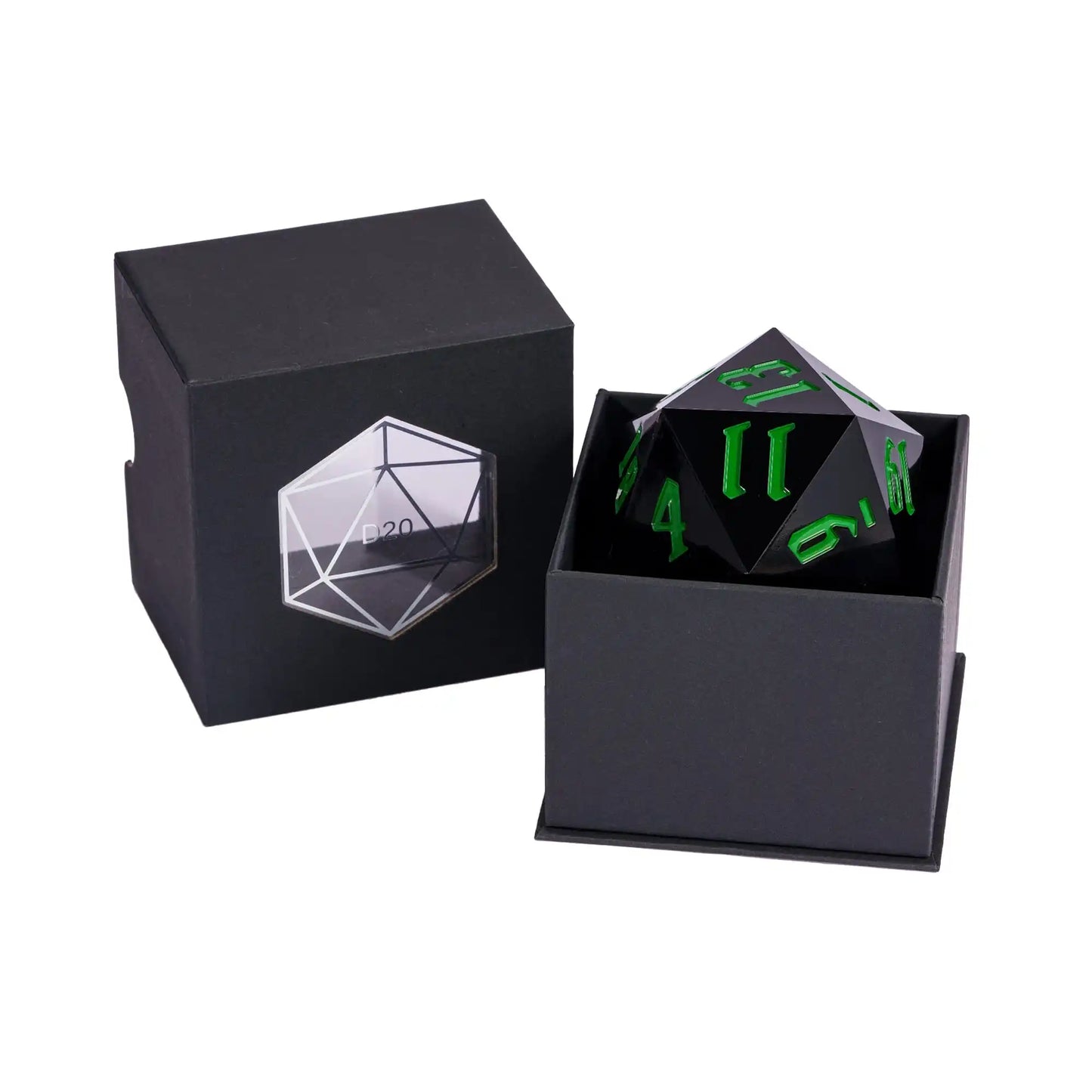 A black d20 gaming die with dark green numbering, shown both inside its open black presentation box and beside it with the matching closed lid on a white background.