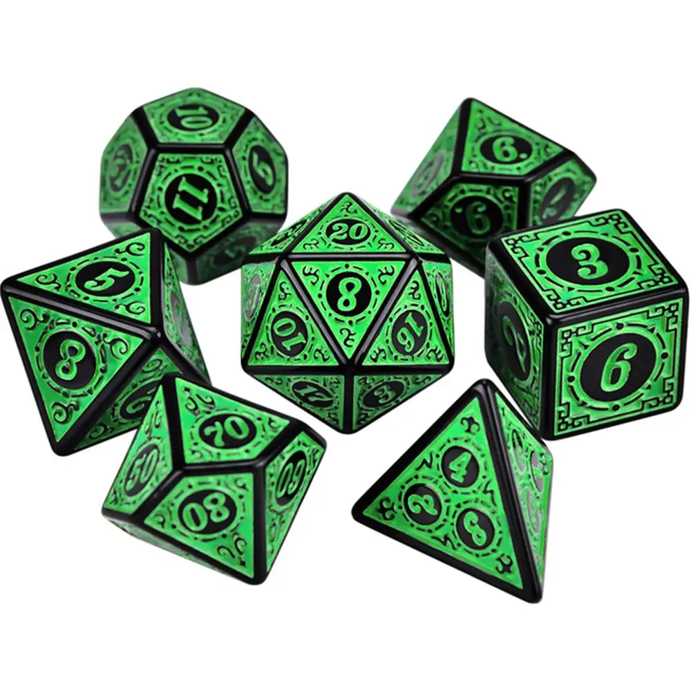 Set of green and black polyhedral dice on a white background