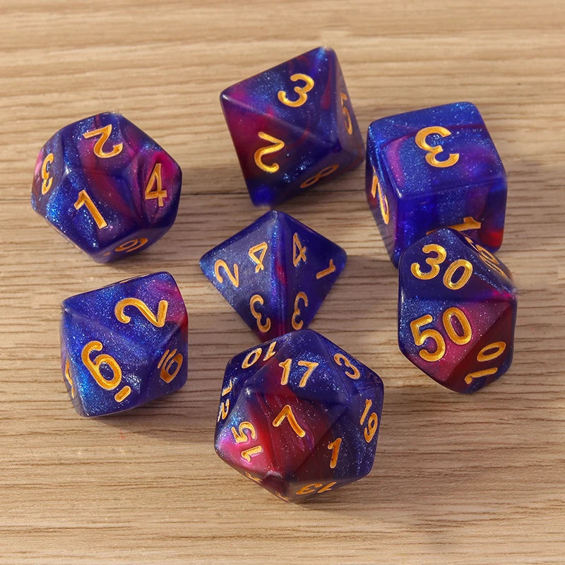 Set of colorful polyhedral dice with numbers on a wooden surface