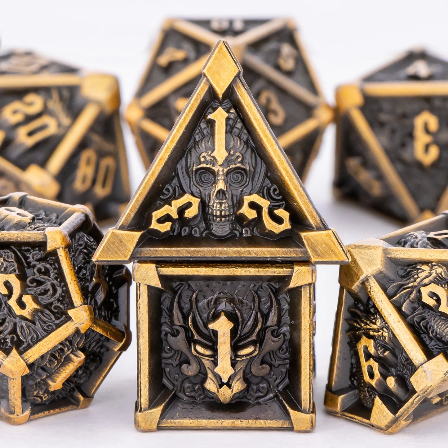 Decorative dice with intricate designs and gold accents on a white background