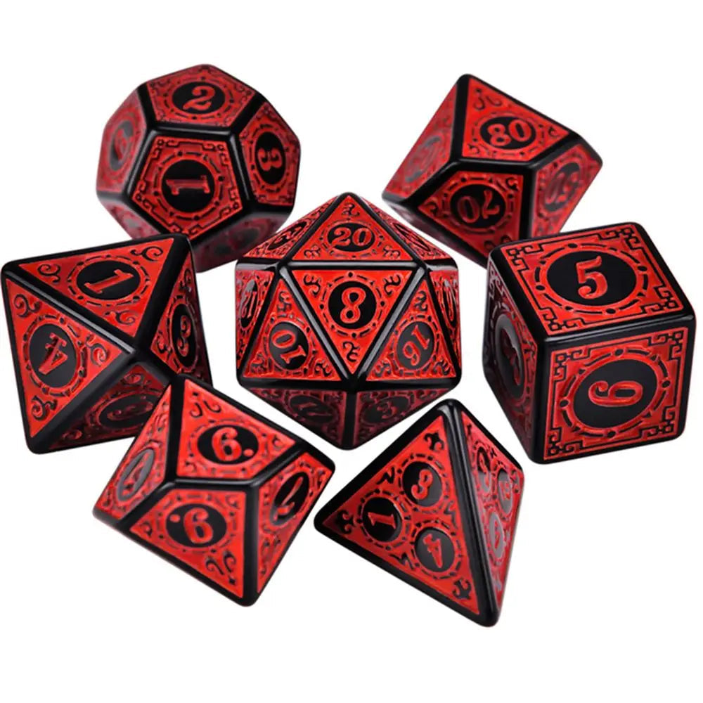 Set of red and black polyhedral dice on a white background