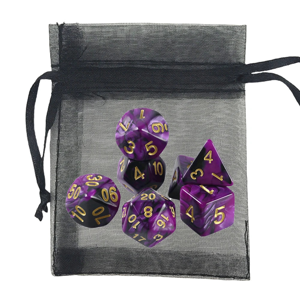 A set of purple and black marbled polyhedral gaming dice with gold numbers, displayed inside a black sheer mesh drawstring bag on a white background.