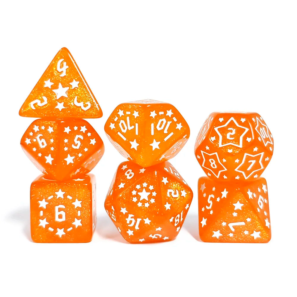 Set of orange dice with white star and number patterns on a white background