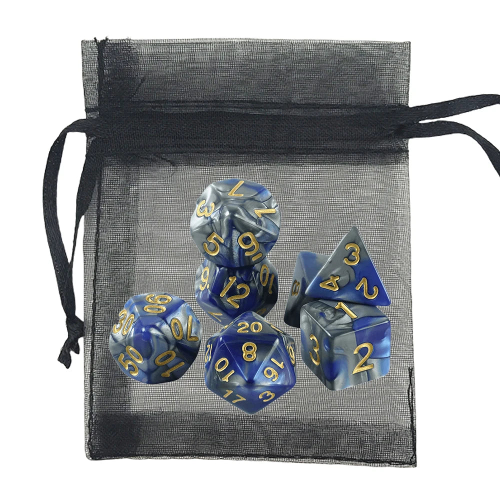A set of blue and silver marbled polyhedral gaming dice with gold numbers, displayed in front of a black sheer mesh drawstring bag on a white background.