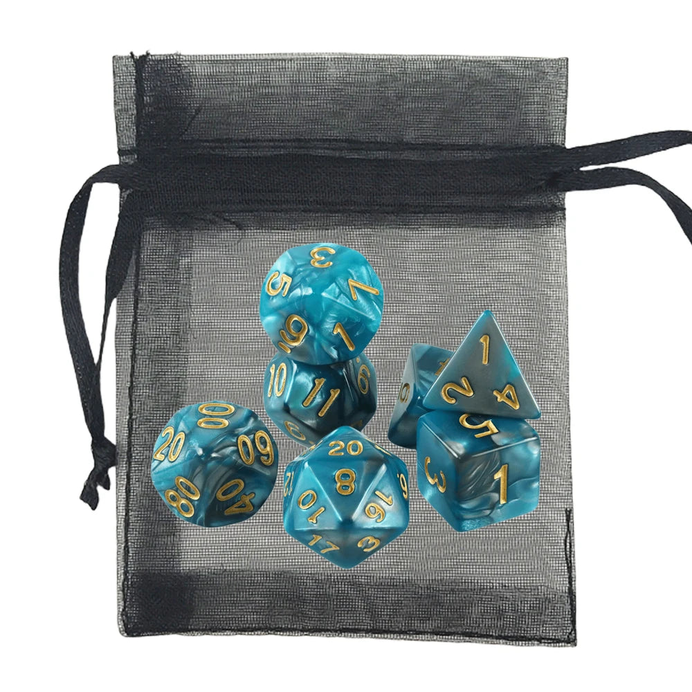A set of translucent teal-blue polyhedral gaming dice with gold numbers, displayed inside a black sheer mesh drawstring pouch on a white background.