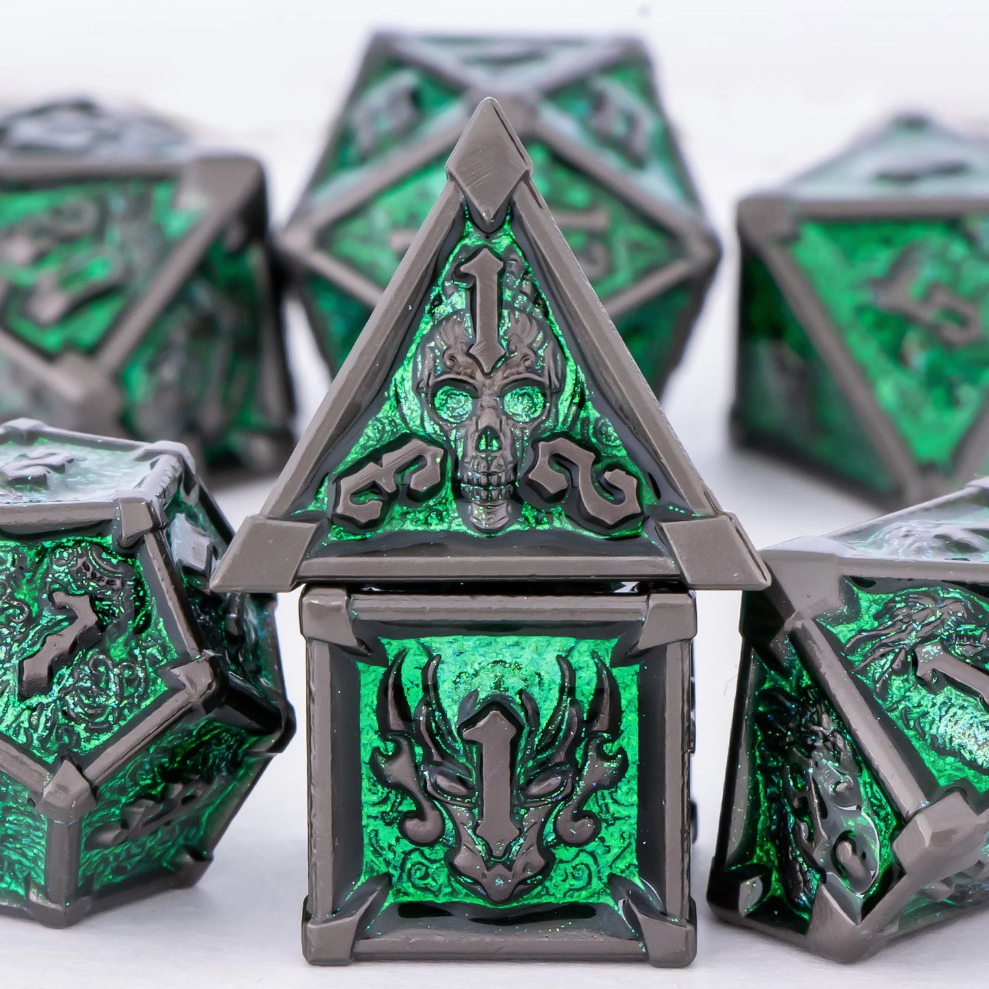 Green and silver polyhedral dice set on a white background