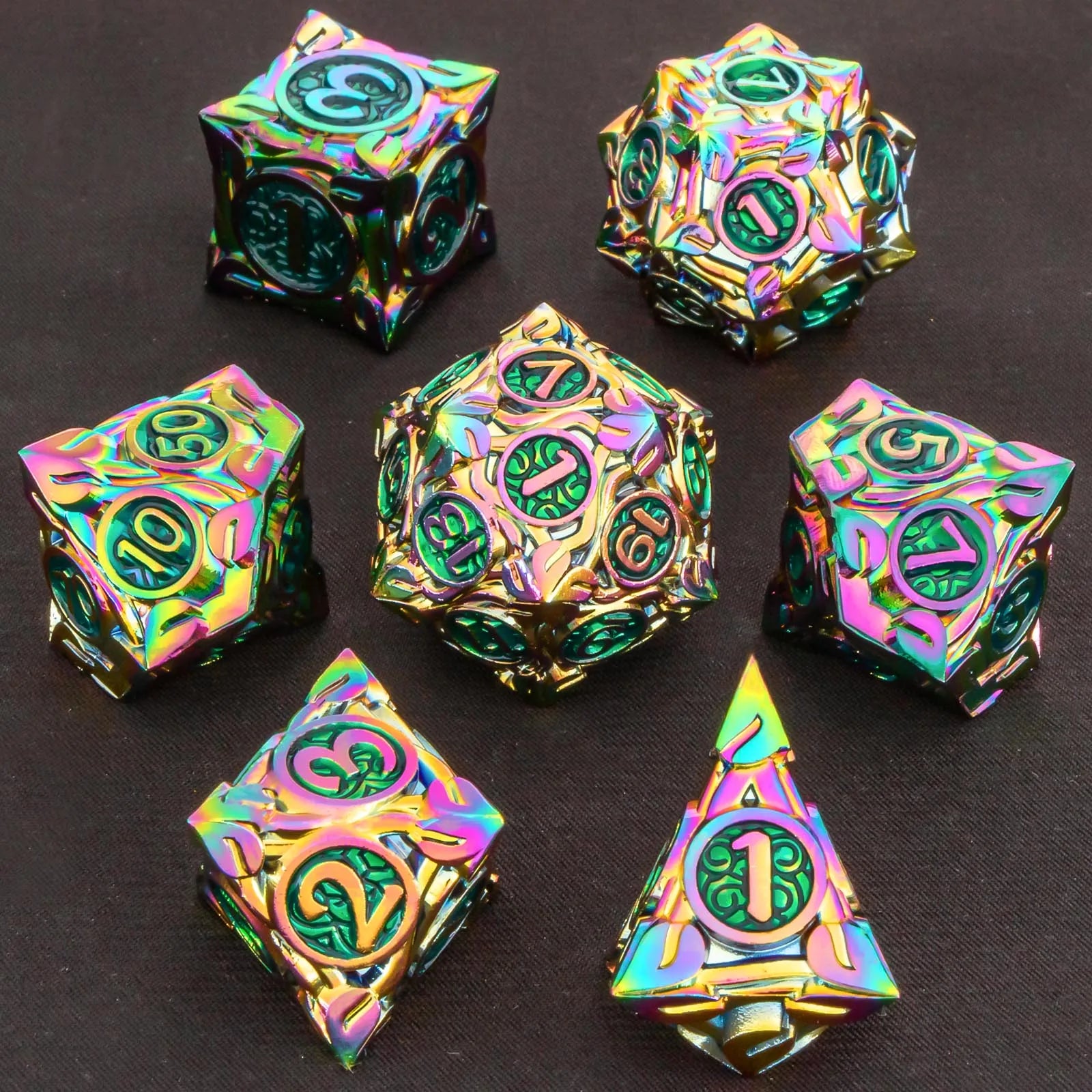 A set of seven polyhedral RPG dice with an iridescent rainbow finish and dark green engraved symbols, arranged on a dark textured background.