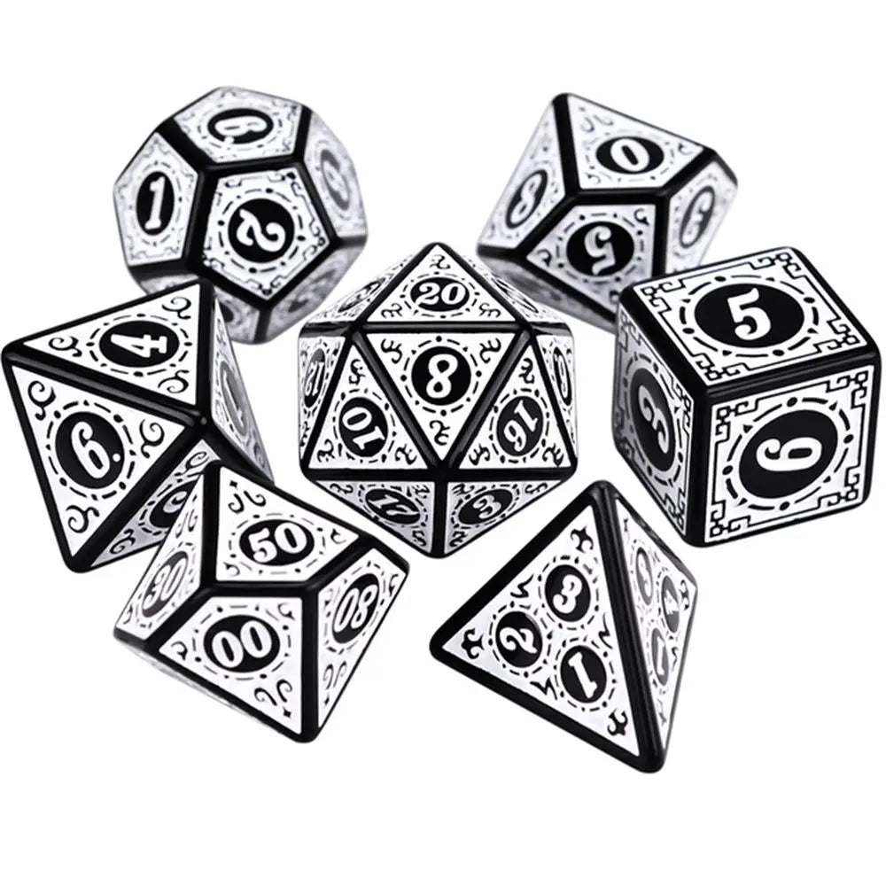 Set of black and white polyhedral dice on a white background