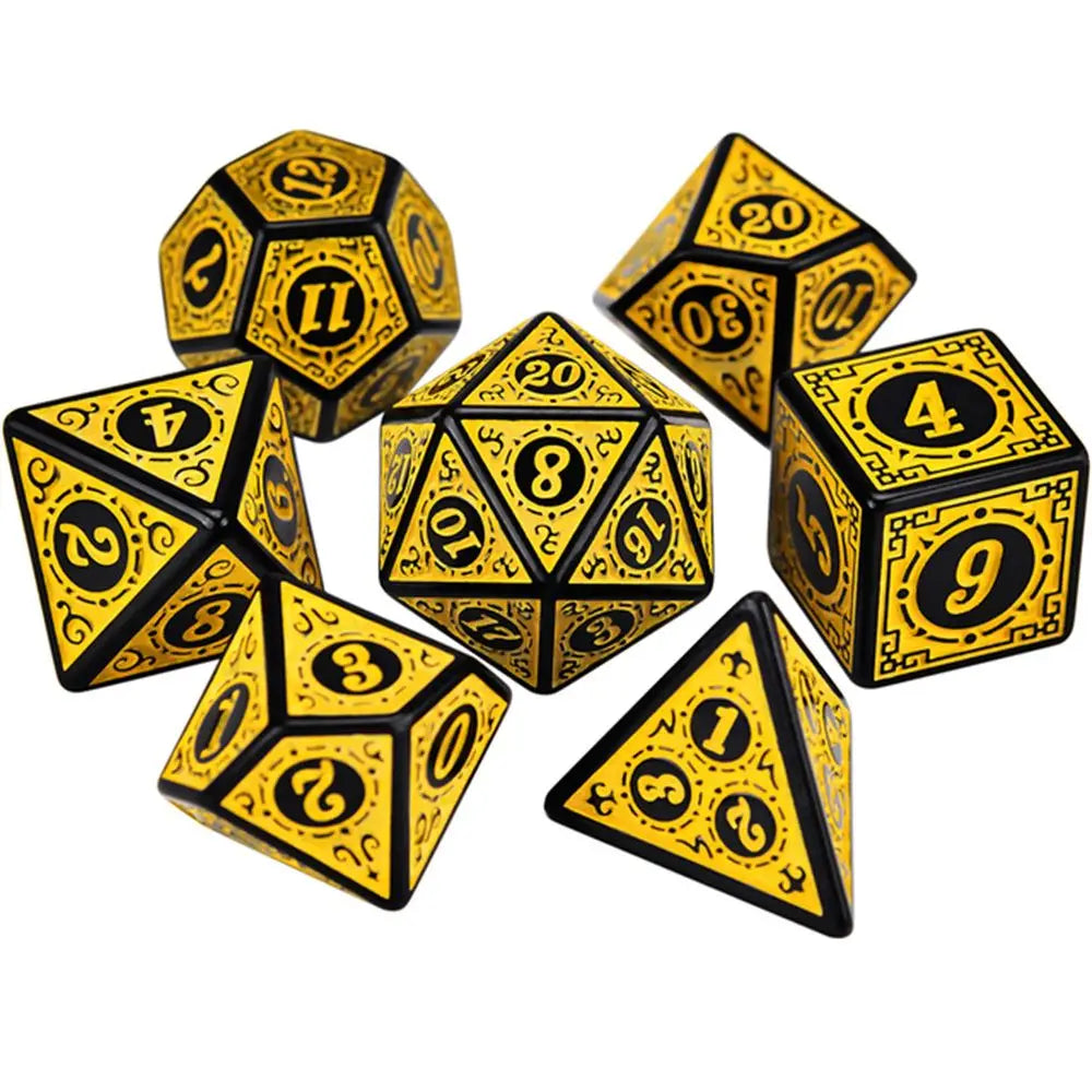 Set of yellow and black polyhedral dice on a white background