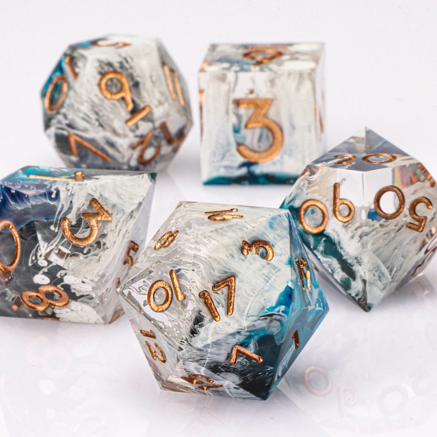 Set of dice with metallic numbers on a white background