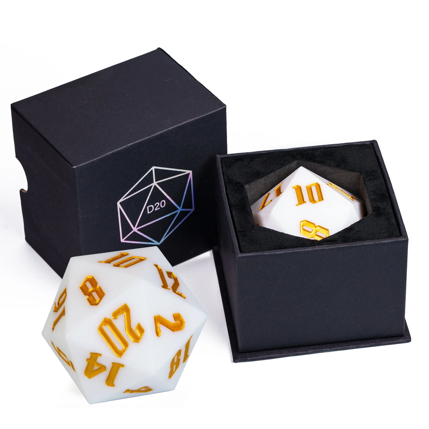 A white 20-sided d20 polyhedral gaming die with gold numbering, shown alongside its open black presentation box and the closed box with a geometric logo.