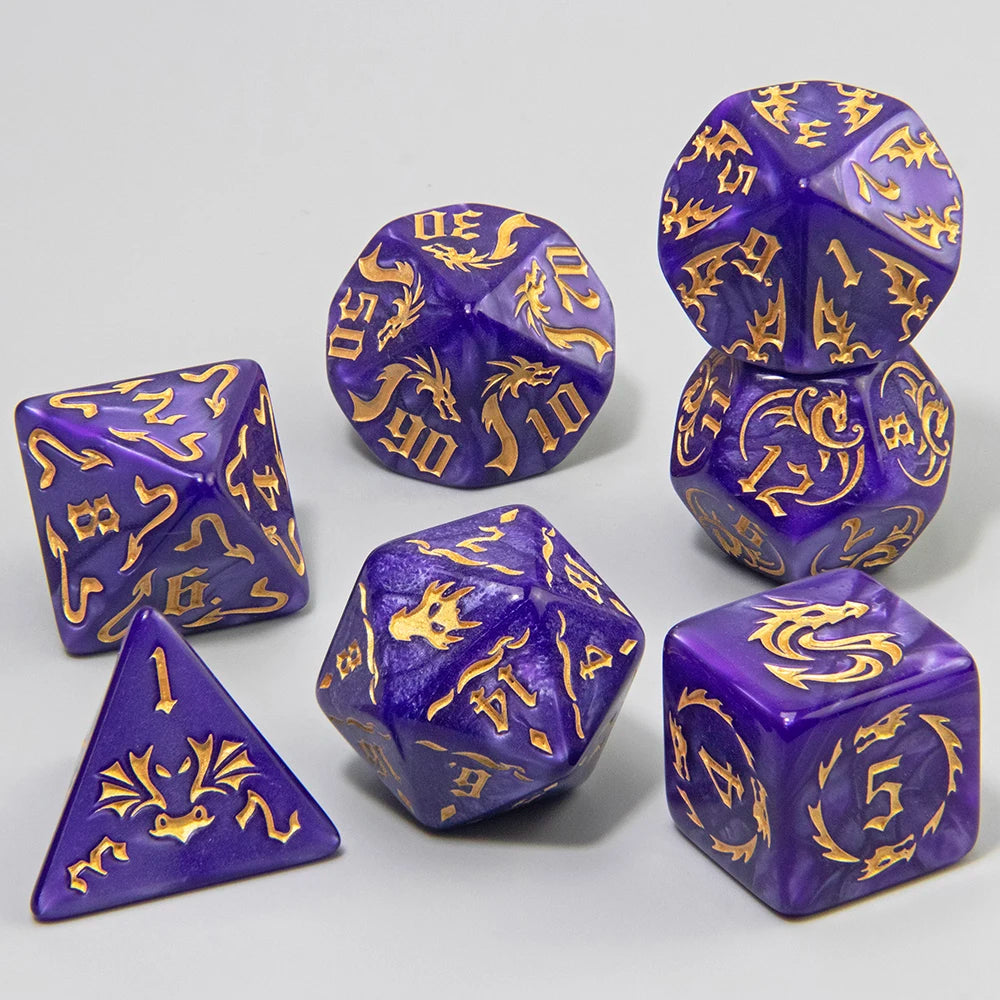 A set of purple polyhedral gaming dice with gold engraved symbols, arranged on a light gray background. The set includes a d10, d20, d100, d6, d12, and d4.