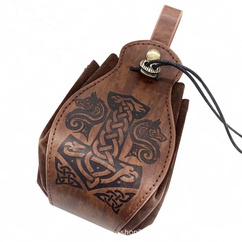 A brown leather pouch featuring Norse-style animal head carvings and a central knotwork design, with a black drawstring and metal snap closure, shown on a white background.