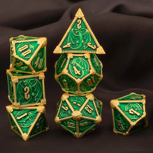A set of green and gold fantasy polyhedral gaming dice arranged on a dark draped fabric background. The set includes a d4, d6, d8, d10, d%, d12, and d20,  with detailed dragon motifs and gold-colored edges and numbering.